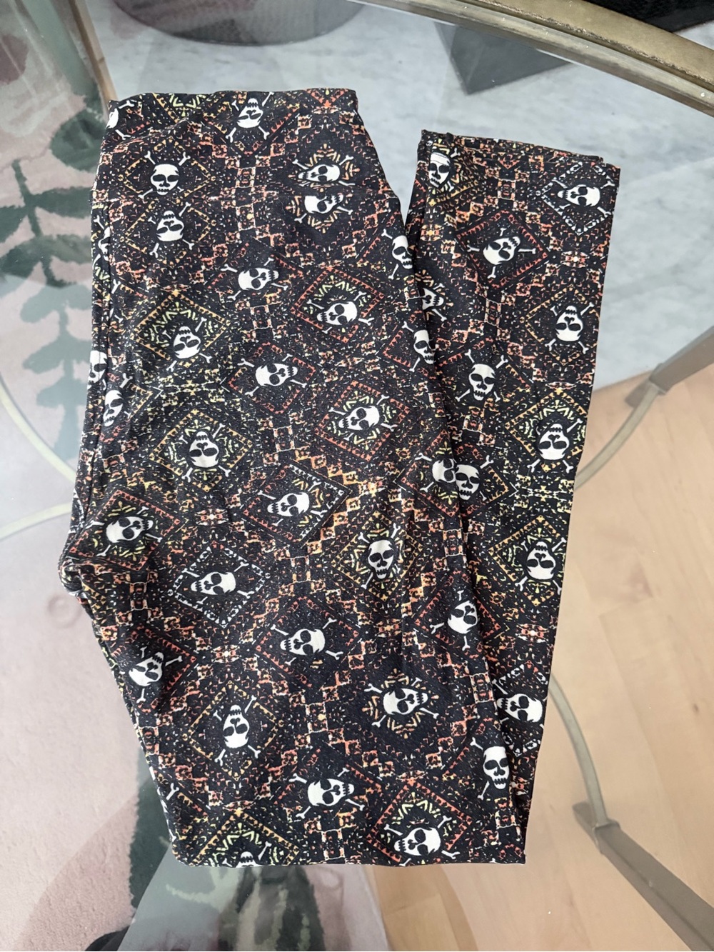 LuLaRoe Black Skull Pattern Leggings with Orange and Yellow Accents